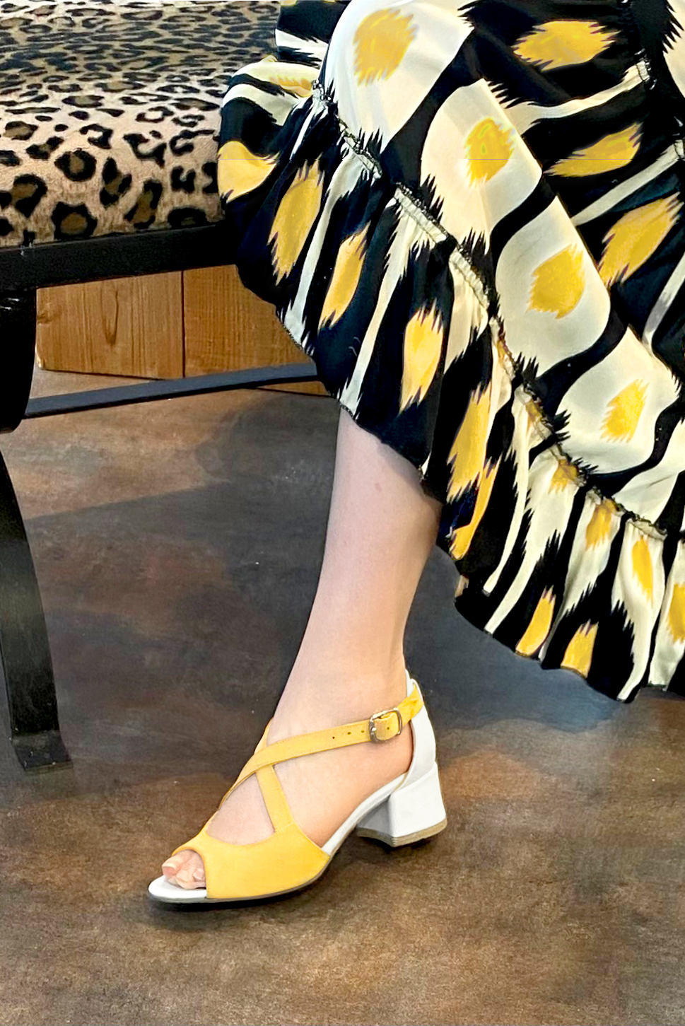 Yellow and off white women's closed back sandals, with crossed straps. Round toe. Low flare heels. Worn view - Florence KOOIJMAN